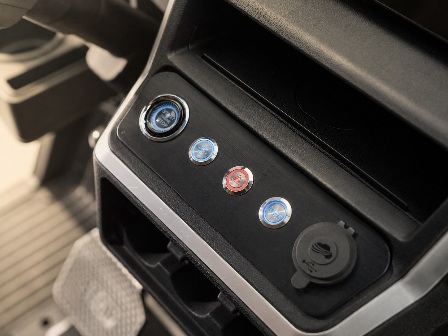 Dashboard control buttons with start, light, and hazard switches