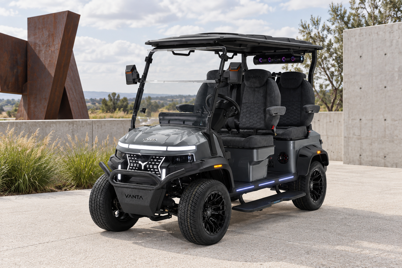 Vanta steel gray electric golf cart in a modern art museum courtyard