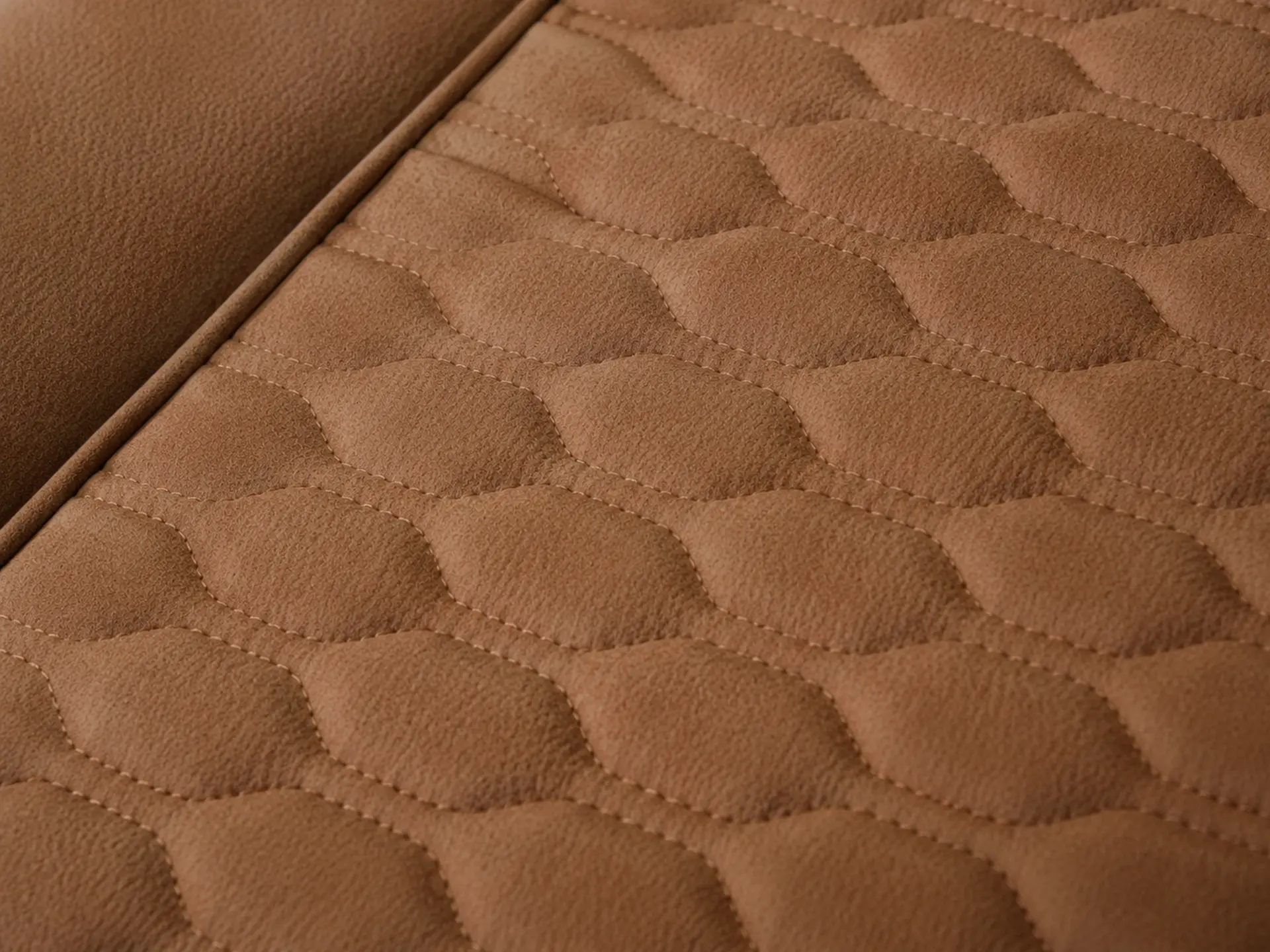 Hand-stitched leather seat and brushed metal armrest detail