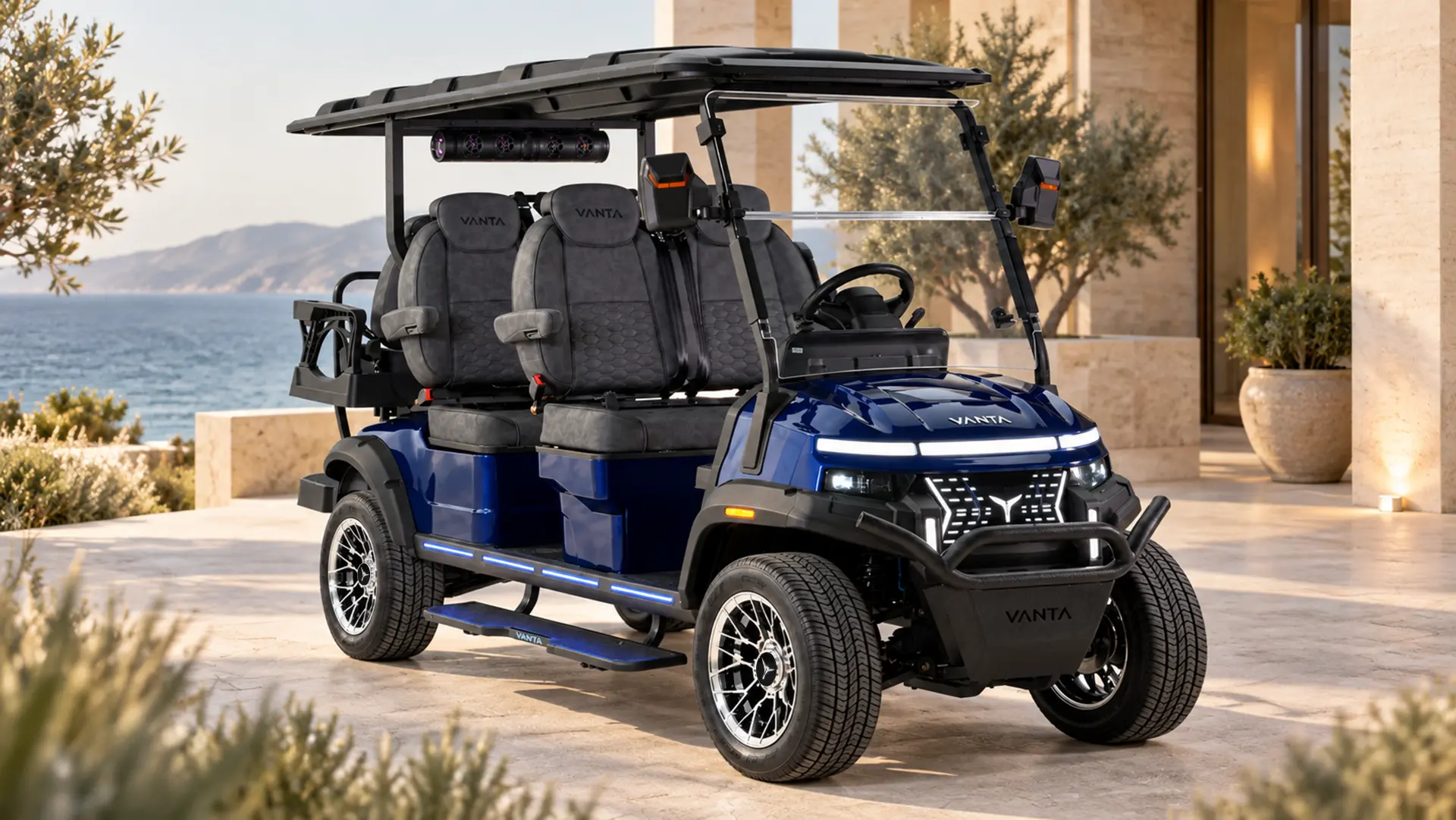 Vanta Kirin K4+2 six-seat electric golf cart in navy blue with silver wheels at a coastal residence