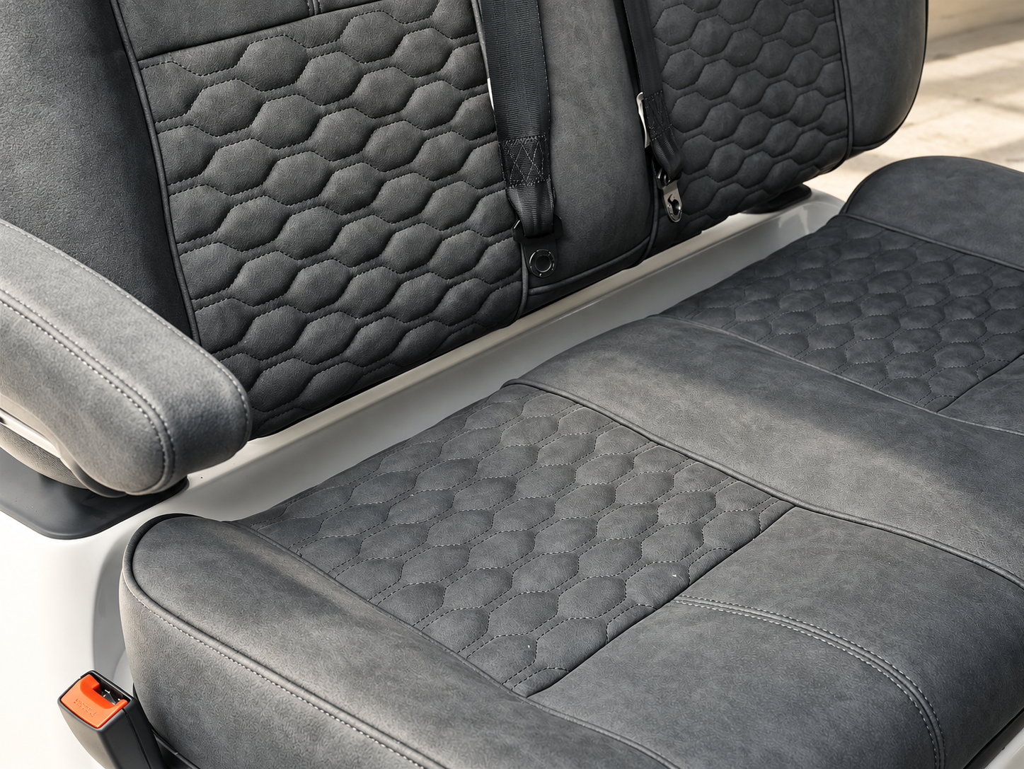 Gray quilted suede seat upholstery top-down view