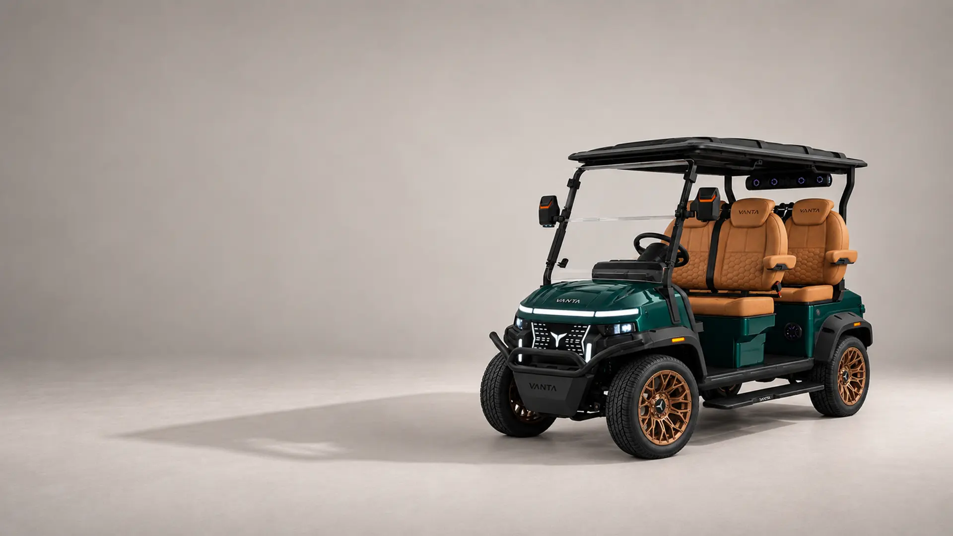 Vanta Mobility Kirin K4 four-seat electric golf cart in deep forest green with bronze wheels and tan leather seats